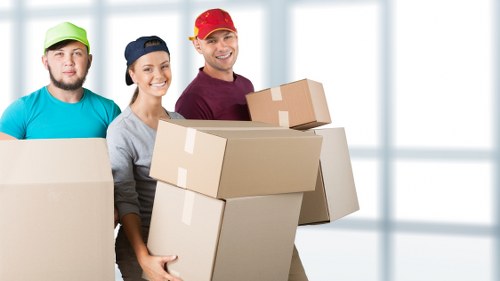 Packed boxes and furniture prepared for a Soho flat move