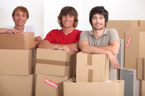 Soho office relocation with boxes and desks being carried