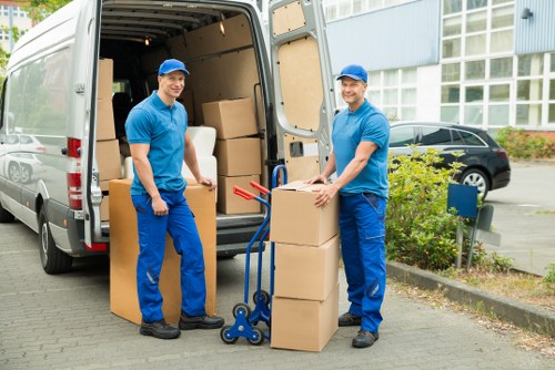 Professional movers handling office equipment in central London