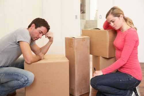 Removal crew transporting furniture in central London