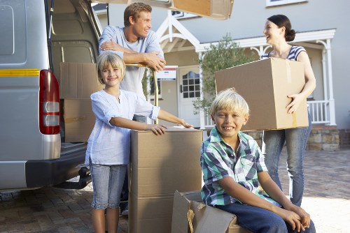 Local team collecting old furniture from a central London flat