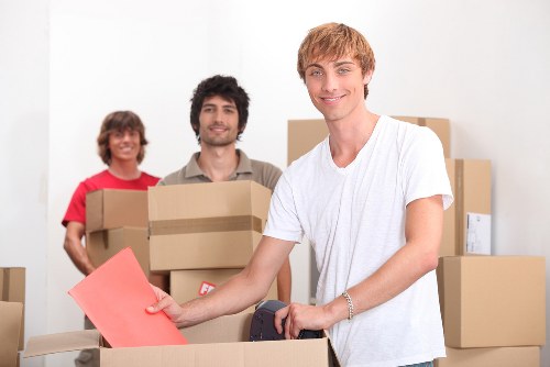 Professional movers handling commercial office equipment in central London